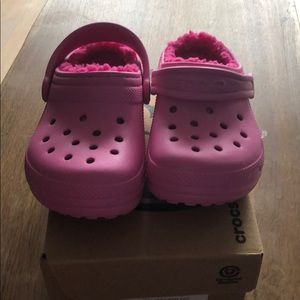 Toddler girls size 8 candy pink crocs with lining.